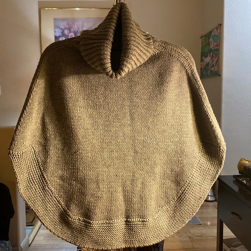 Turtle Neck Knitted No Sleeves Sweater.